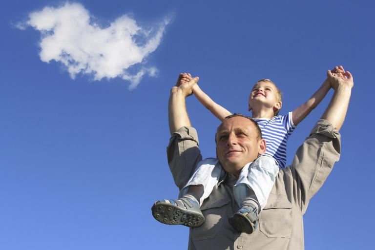Dad with son on shoulders