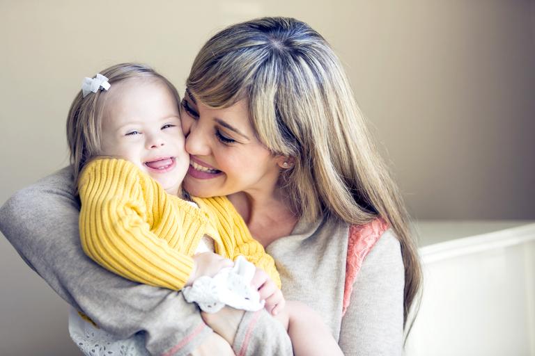 Mum cuddling child
