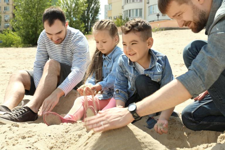 Dads and children at beach