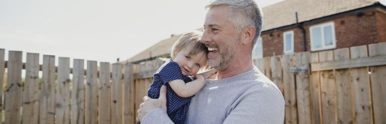 Father & daughter in garden