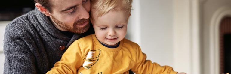 Dad reading with son