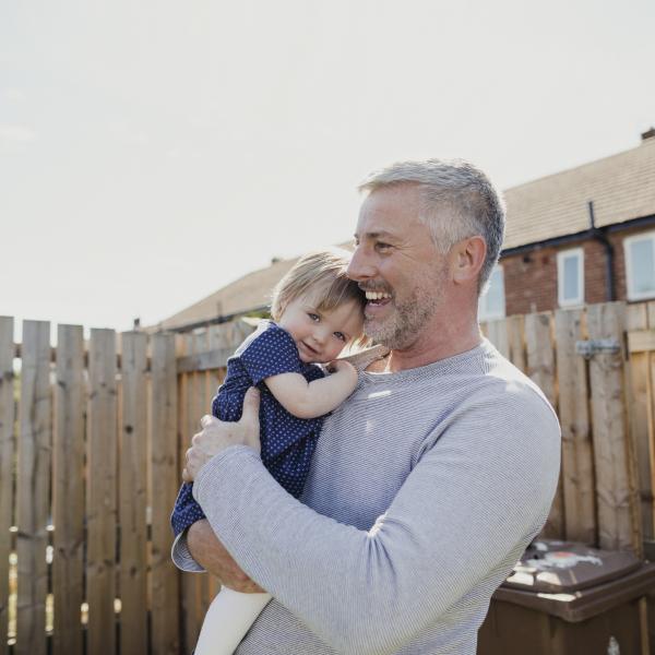 Father & daughter in garden